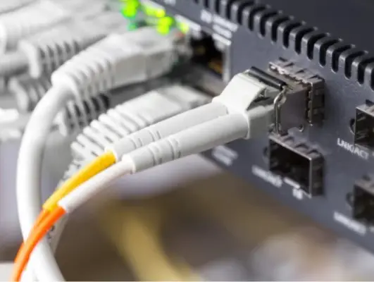 High-speed network cables connected to a server, representing networking solutions Norwich & Norfolk, secure IT infrastructure, and business connectivity.