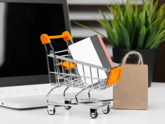 Mini shopping cart with a credit card, representing eCommerce web design Norwich & Norfolk, secure online stores, and digital shopping solutions.